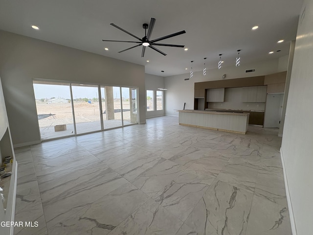 11345 Ardelle Ave, El Paso, TX 79936 - unfurnished living room featuring visible vents, recessed lighting, marble finish floor, and a ceiling fan