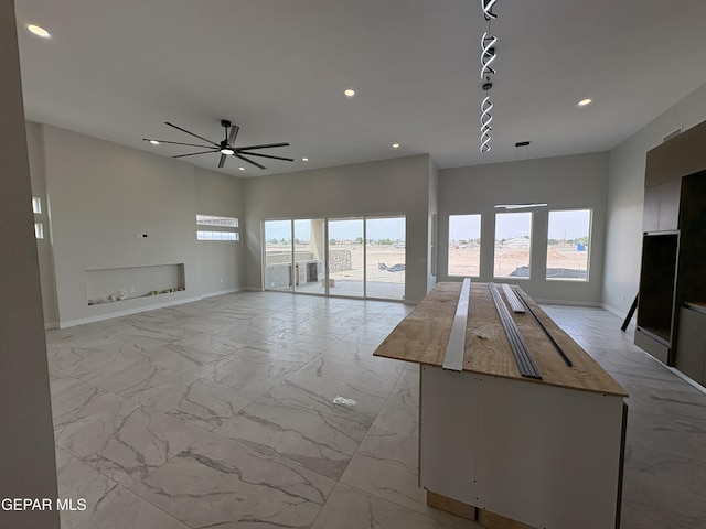 11345 Ardelle Ave, El Paso, TX 79936 - unfurnished living room with baseboards, recessed lighting, marble finish floor, and a ceiling fan