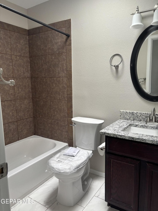 full bathroom featuring vanity,  shower combination, marble finish floor, and toilet