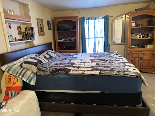 8154 Holloway Pl, El Paso, TX 79907 - bedroom with concrete flooring