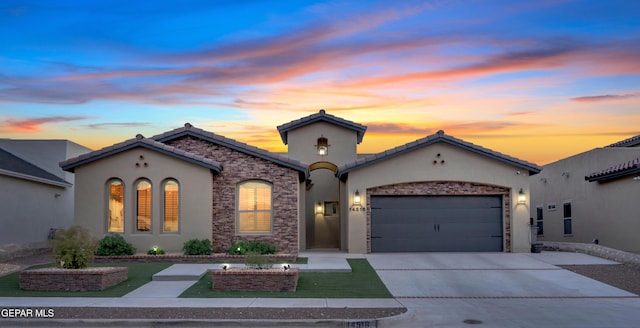14516 Petralia, El Paso, TX 79938 - mediterranean / spanish-style house featuring stucco siding, concrete driveway, an attached garage, and a tile roof