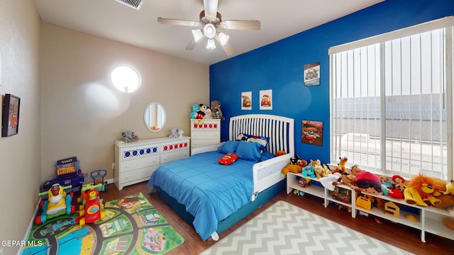 7350 La Casa Way, Canutillo, TX 79835 - bedroom featuring ceiling fan, wood finished floors, and multiple windows