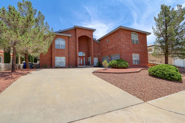 5628 Buckley Dr, El Paso, TX 79912 - traditional-style home with concrete driveway, brick siding, and an attached garage