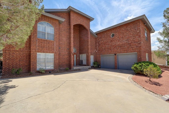 5628 Buckley Dr, El Paso, TX 79912 - traditional-style home featuring brick siding, driveway, and an attached garage