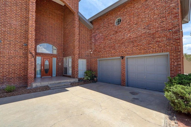 5628 Buckley Dr, El Paso, TX 79912 - exterior space featuring brick siding, driveway, and an attached garage