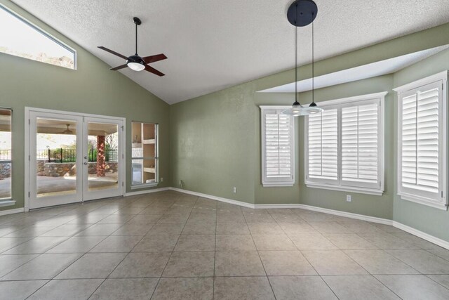 5628 Buckley Dr, El Paso, TX 79912 - tiled spare room featuring a textured ceiling, high vaulted ceiling, ceiling fan, and a wealth of natural light