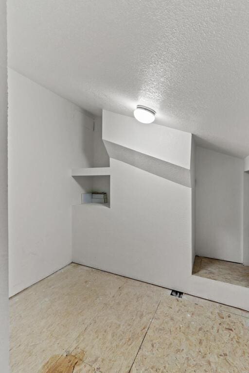 5628 Buckley Dr, El Paso, TX 79912 - spare room featuring a textured ceiling