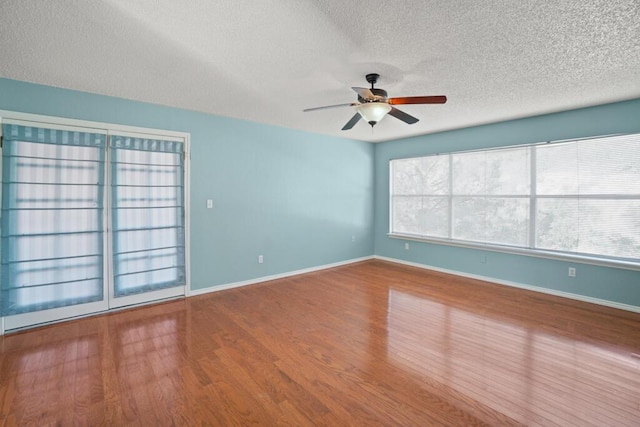 5628 Buckley Dr, El Paso, TX 79912 - empty room with ceiling fan, baseboards, wood finished floors, and a textured ceiling