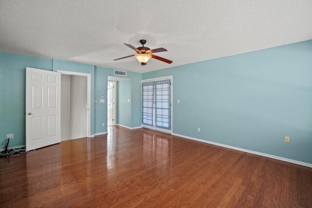 5628 Buckley Dr, El Paso, TX 79912 - unfurnished room with a textured ceiling, a ceiling fan, visible vents, wood finished floors, and baseboards