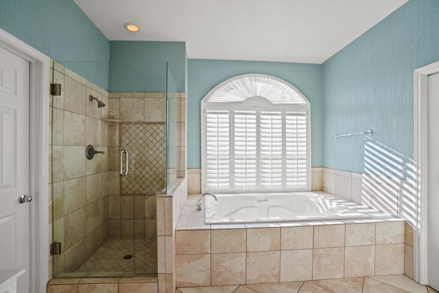 5628 Buckley Dr, El Paso, TX 79912 - bathroom featuring a shower stall and a bath