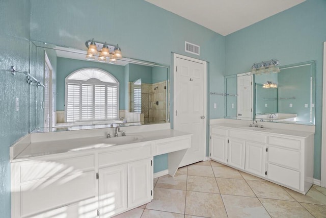 5628 Buckley Dr, El Paso, TX 79912 - bathroom with a tile shower, visible vents, tile patterned floors, and a sink
