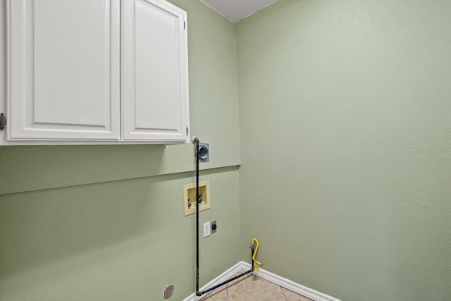 5628 Buckley Dr, El Paso, TX 79912 - clothes washing area with hookup for a washing machine, tile patterned flooring, hookup for an electric dryer, baseboards, and cabinet space