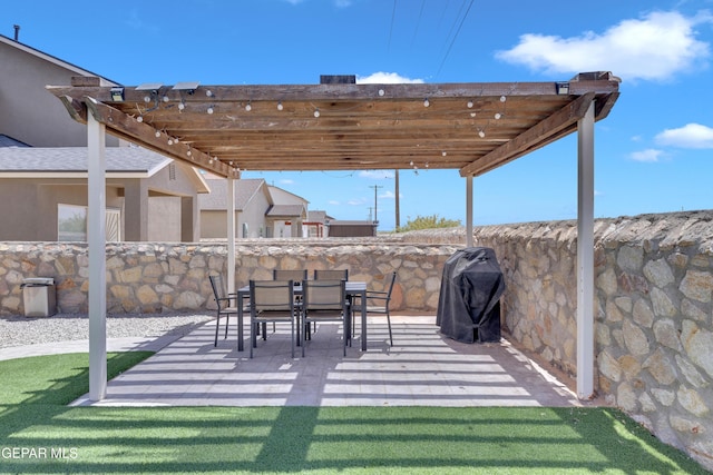 3841 Loma Adriana, El Paso, TX 79938 - view of patio with grilling area and a pergola