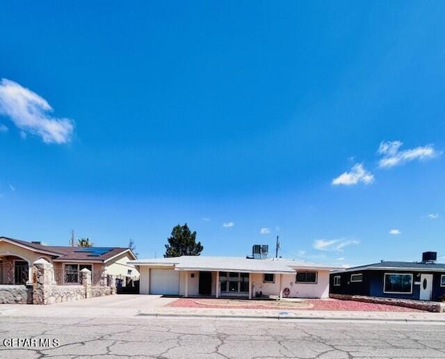7603 Parral Dr, El Paso, TX 79915 - ranch-style house featuring concrete driveway and a garage