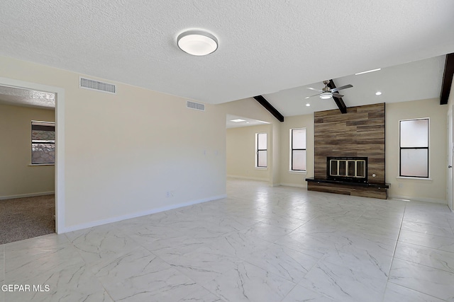 unfurnished living room with lofted ceiling, visible vents, a ceiling fan, and baseboards