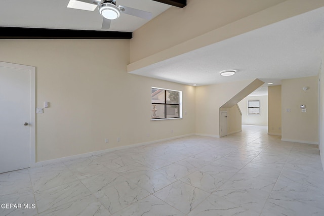 bonus room featuring marble finish floor, baseboards, and ceiling fan