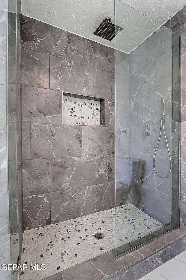 bathroom featuring a walk in shower