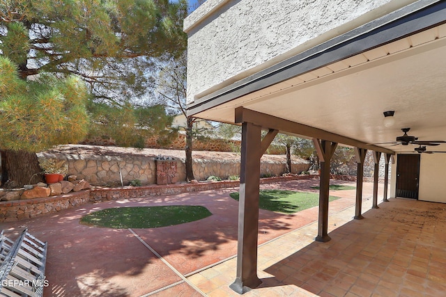view of patio / terrace with fence and ceiling fan