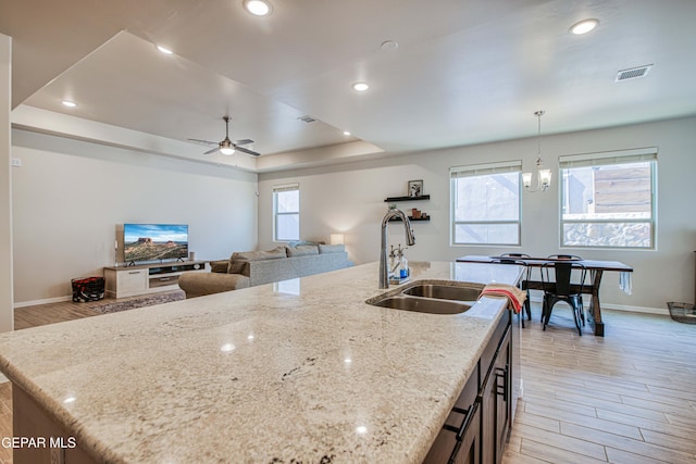 951 Airship Pl, El Paso, TX 79928 - kitchen featuring a sink, baseboards, light wood-type flooring, hanging light fixtures, and recessed lighting