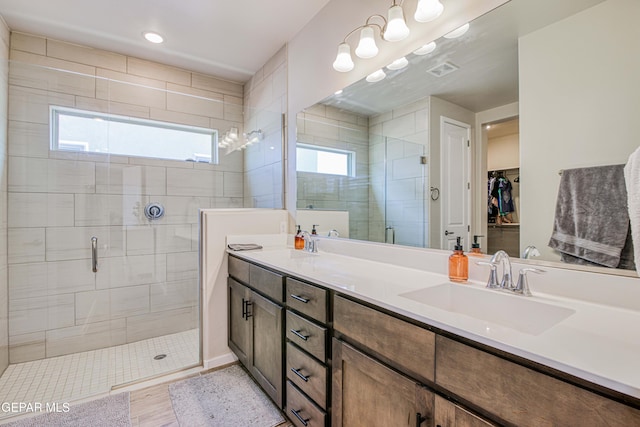 951 Airship Pl, El Paso, TX 79928 - bathroom with a shower stall, double vanity, and a spacious closet