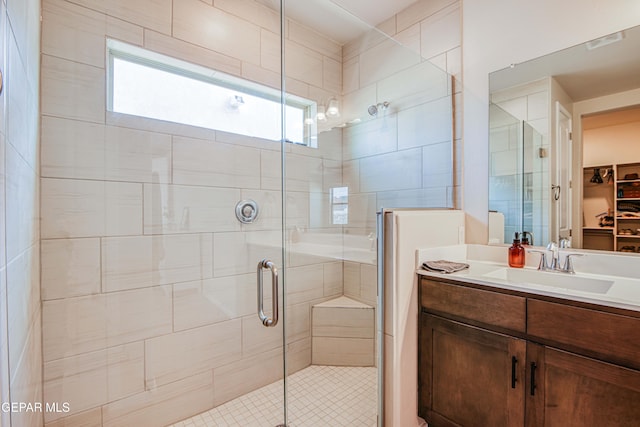 951 Airship Pl, El Paso, TX 79928 - bathroom with vanity, a stall shower, and a spacious closet
