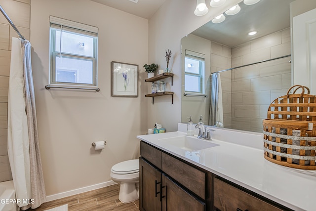 951 Airship Pl, El Paso, TX 79928 - bathroom featuring baseboards, wood tiled floors, vanity, toilet, and shower / bath combo