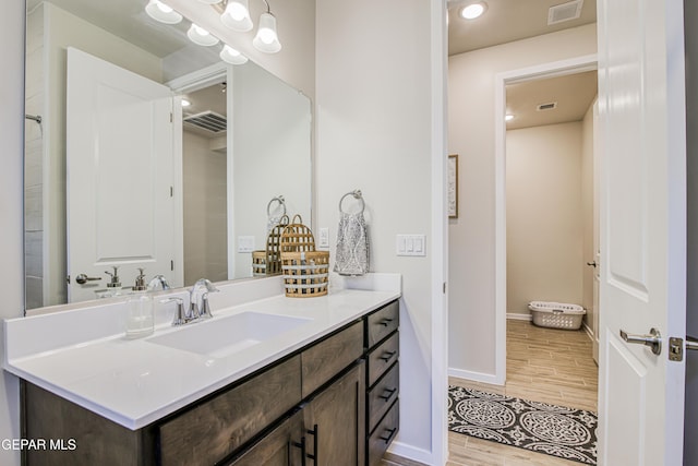 951 Airship Pl, El Paso, TX 79928 - bathroom with vanity, wood finished floors, baseboards, and recessed lighting