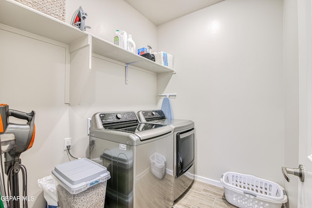 951 Airship Pl, El Paso, TX 79928 - laundry room with washing machine and dryer, light wood-style flooring, and baseboards