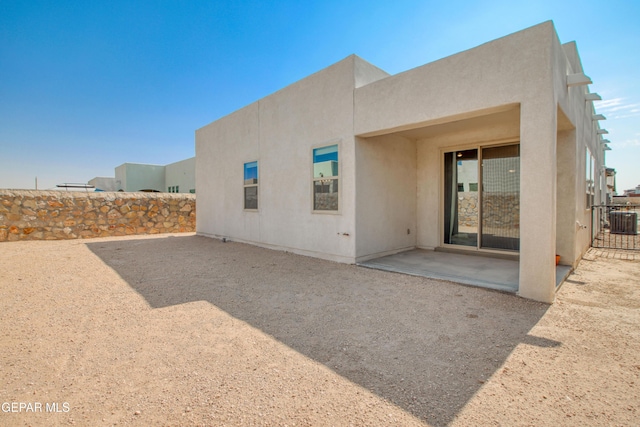 951 Airship Pl, El Paso, TX 79928 - rear view of house with central air condition unit, a patio area, and stucco siding