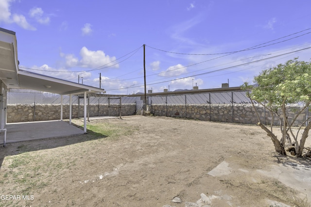 view of yard with a patio area and a fenced backyard