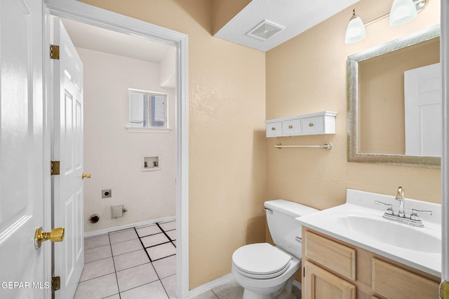 half bathroom with tile patterned flooring, visible vents, toilet, vanity, and baseboards