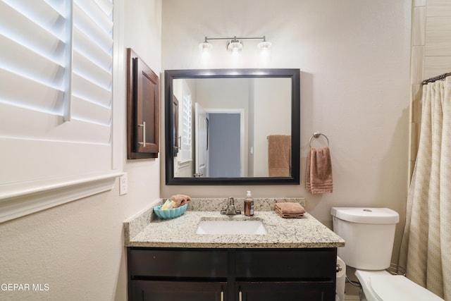 7825 Enchanted Ridge Dr, El Paso, TX 79911 - full bathroom with toilet and vanity