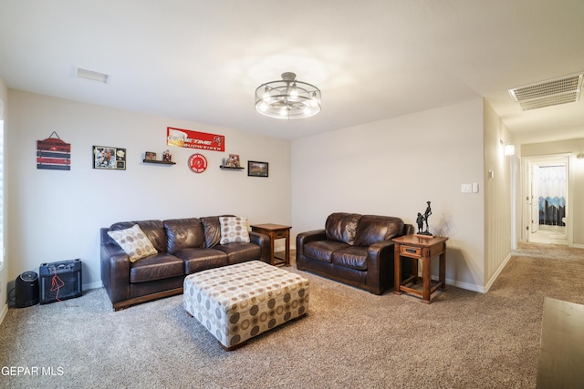 7825 Enchanted Ridge Dr, El Paso, TX 79911 - carpeted living area featuring visible vents, baseboards, and a notable chandelier