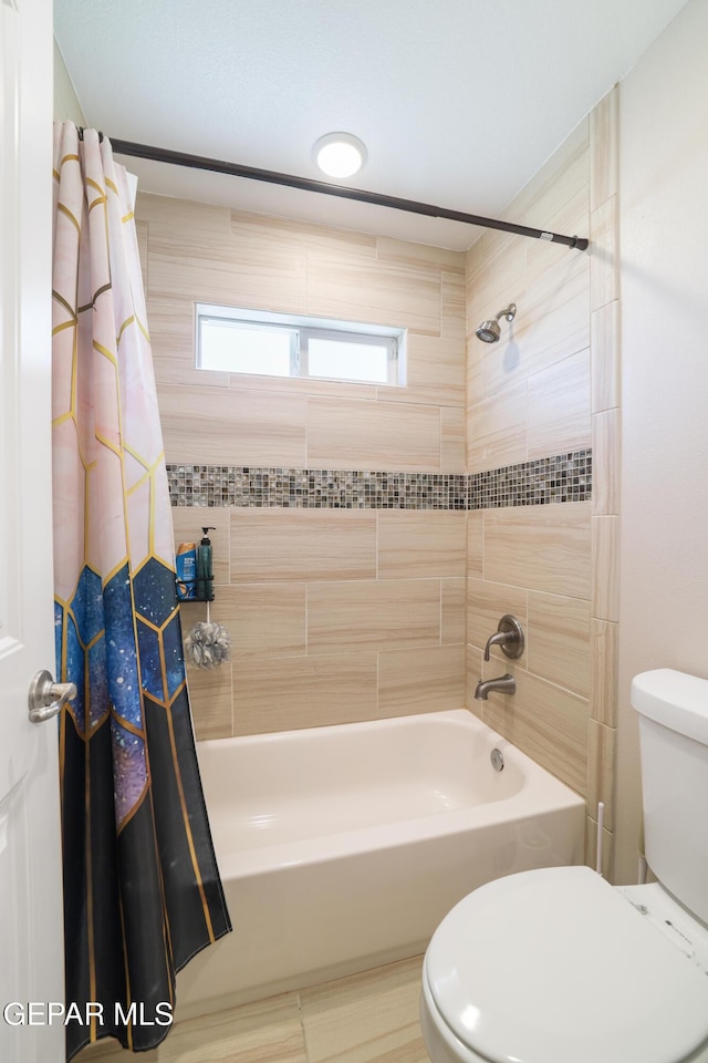 7825 Enchanted Ridge Dr, El Paso, TX 79911 - bathroom featuring shower / tub combo and toilet