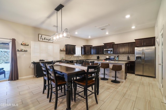 7825 Enchanted Ridge Dr, El Paso, TX 79911 - dining space featuring recessed lighting, wood finish floors, visible vents, and baseboards