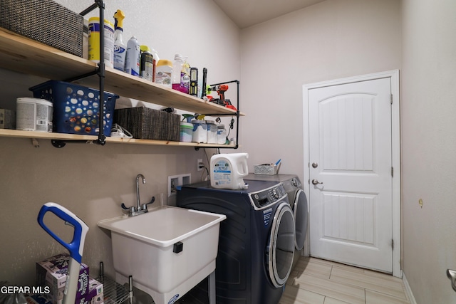 7825 Enchanted Ridge Dr, El Paso, TX 79911 - laundry area with baseboards, washer and clothes dryer, laundry area, and a sink