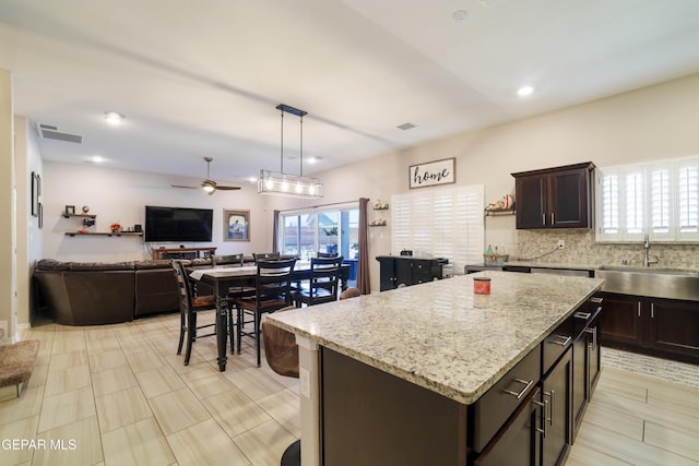 7825 Enchanted Ridge Dr, El Paso, TX 79911 - kitchen with open floor plan, a ceiling fan, a sink, and plenty of natural light
