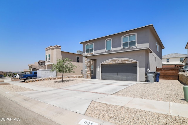 7825 Enchanted Ridge Dr, El Paso, TX 79911 - view of front of home with an attached garage, driveway, and stucco siding