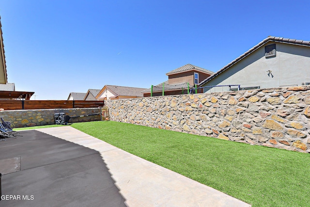 13877 Paseo Perlas Dr, El Paso, TX 79928 - view of yard featuring a patio area and a fenced backyard