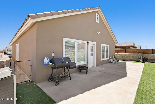 13877 Paseo Perlas Dr, El Paso, TX 79928 - rear view of house with fence, a patio, and stucco siding