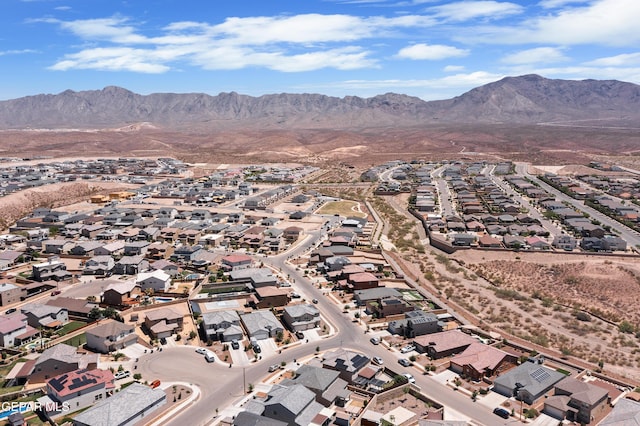 drone / aerial view featuring a residential view and a mountain view