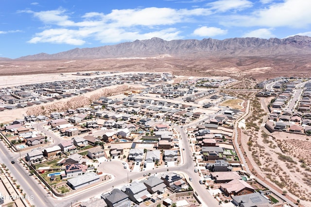 birds eye view of property with a mountain view and a residential view