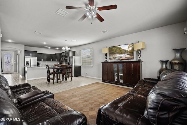living area with recessed lighting, visible vents, ceiling fan, and baseboards