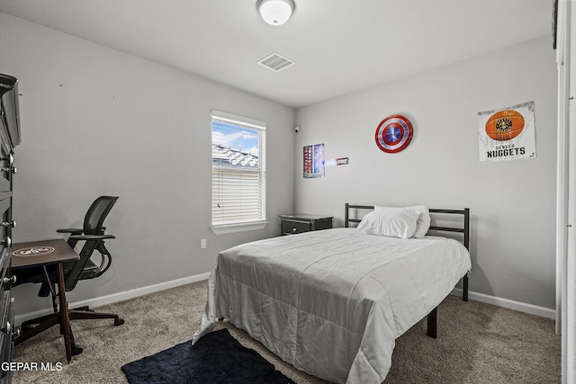 carpeted bedroom featuring visible vents and baseboards