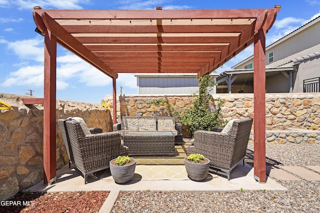 view of patio / terrace with an outdoor living space, a fenced backyard, and a pergola