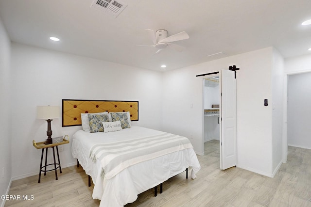 bedroom featuring recessed lighting, light wood-style floors, visible vents, and baseboards