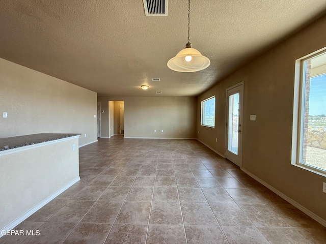 312 Via Cumbre Linda Cir, El Paso, TX 79928 - interior space with baseboards, tile patterned floors, a textured ceiling, and visible vents