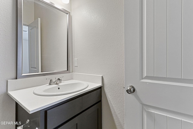1205 Night Sky St, Horizon City, TX 79928 - bathroom with a textured wall and vanity