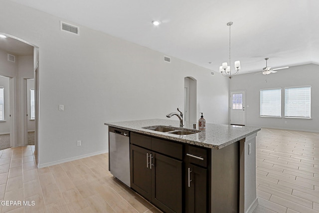 1205 Night Sky St, Horizon City, TX 79928 - kitchen with stainless steel dishwasher, a sink, open floor plan, arched walkways, and visible vents