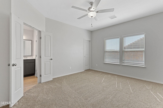 1205 Night Sky St, Horizon City, TX 79928 - unfurnished bedroom featuring connected bathroom, light carpet, visible vents, and baseboards